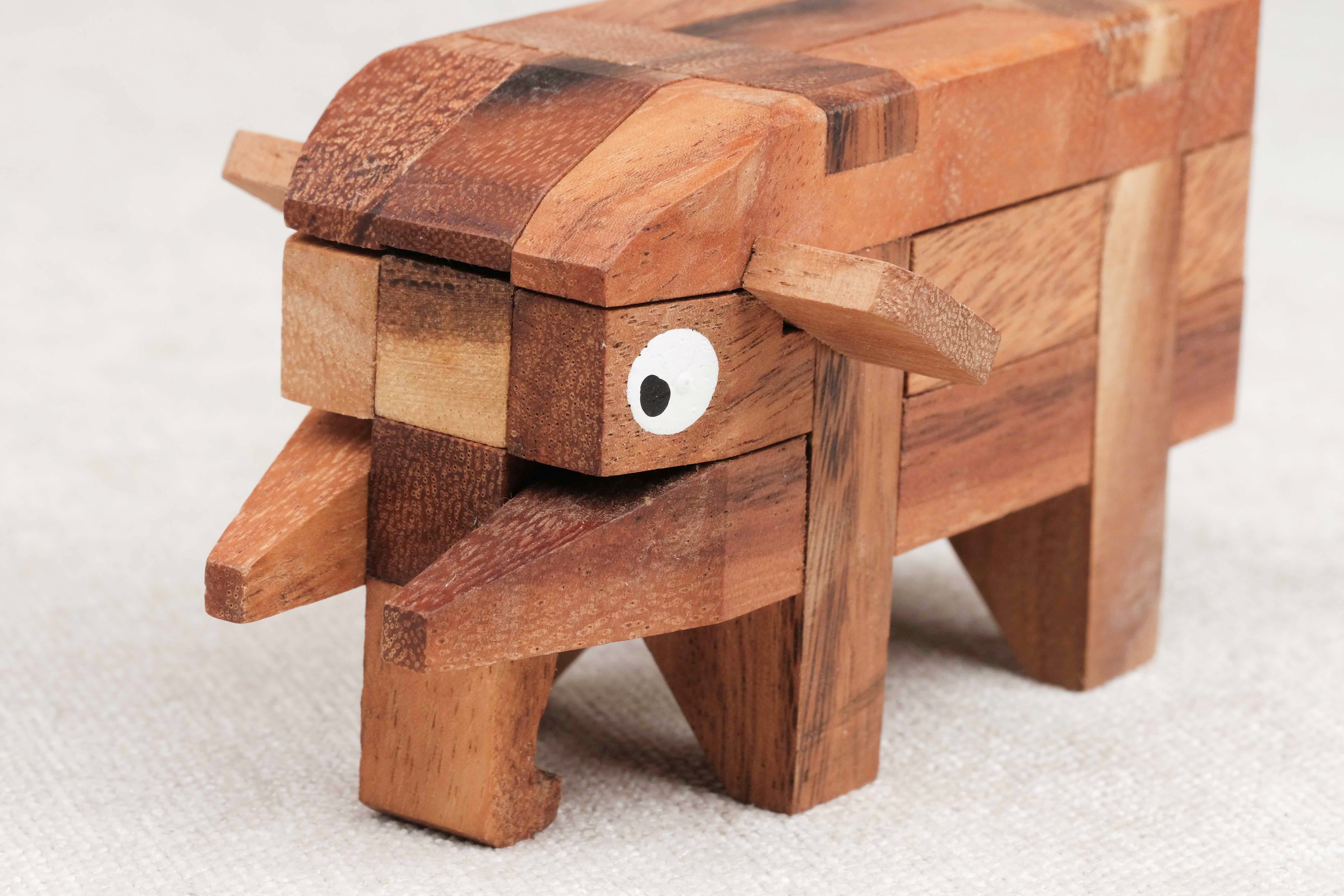 Casse-tête L’Éléphant en bois – détail de la tête avec défenses et trompe