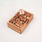 Coffret 6 casse-têtes en bois sur fond clair
