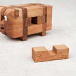 Casse-tête en bois Le Cochon avec une pièce sortie – puzzle démonté et à reconstituer