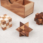 Les 3 casse-têtes déployés à côté du coffret