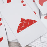 Vue de plusieurs cartes défis en bois étalées – Double Tangram Cœur Jeux Faugère