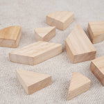 Pièces du tangram cœur en bois disposées à plat – Double Tangram Cœur Jeux Faugère