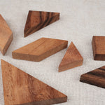 Pièces des tangrams en bois d'acacia disposées à plat – Double Tangram Jeux Faugère