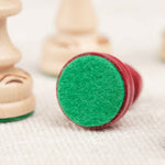 Base d’une pièce d’échecs avec feutrine verte protectrice