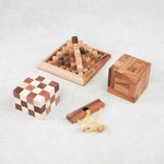 Les trois casse-têtes du pack alignés sur fond clair : Double Cube, convolution, Kheops avec le mini casse-tête offert Roméo et Juliette