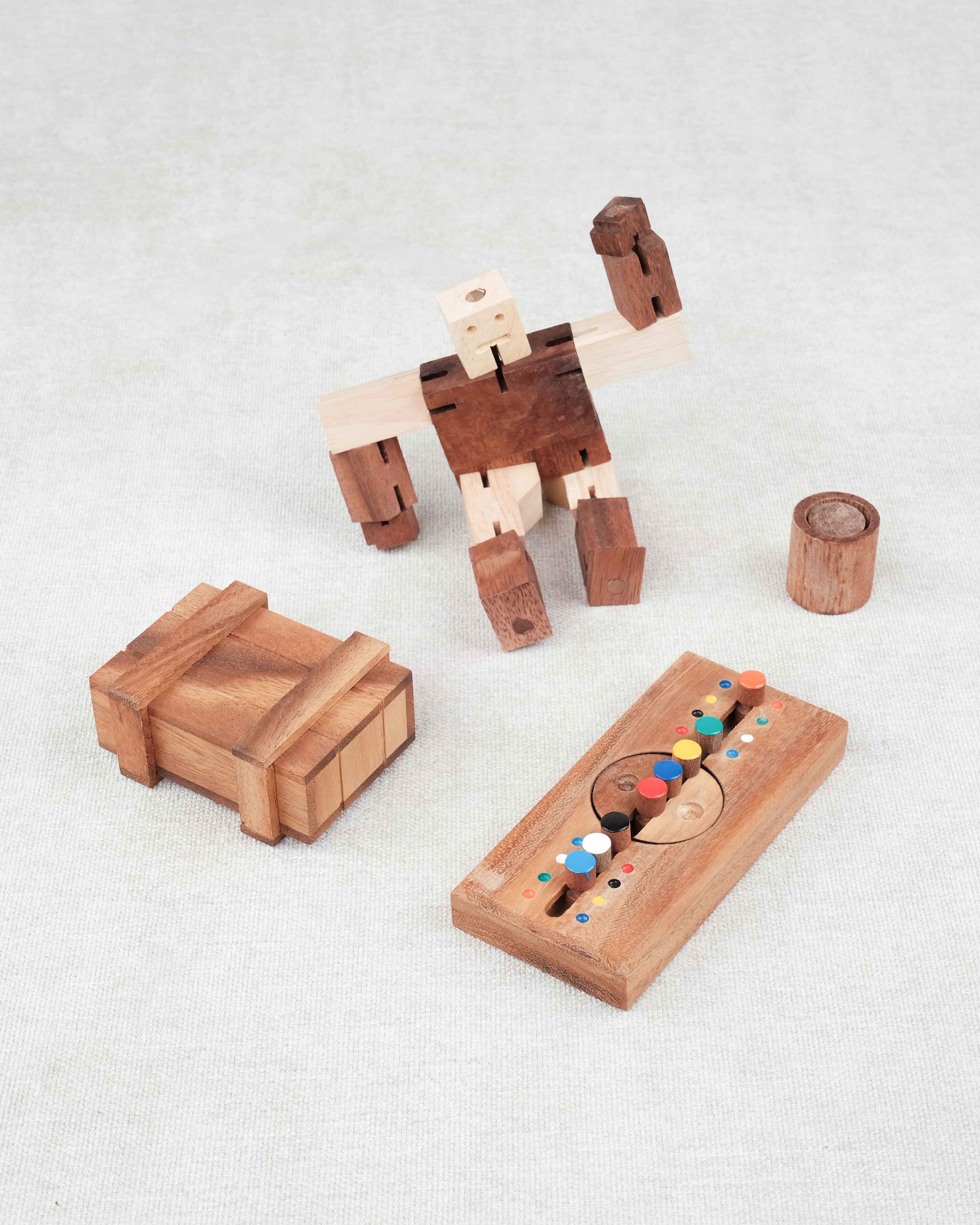 Vue d’ensemble du Pack Malin « Casse-têtes Premiers Défis » avec ses trois casse-têtes et le mini offert