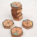 Pions hexagonaux en bois sérigraphiés et colorés pour Hexadomino