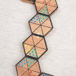 Enchaînement de pièces d’Hexadomino formant une ligne