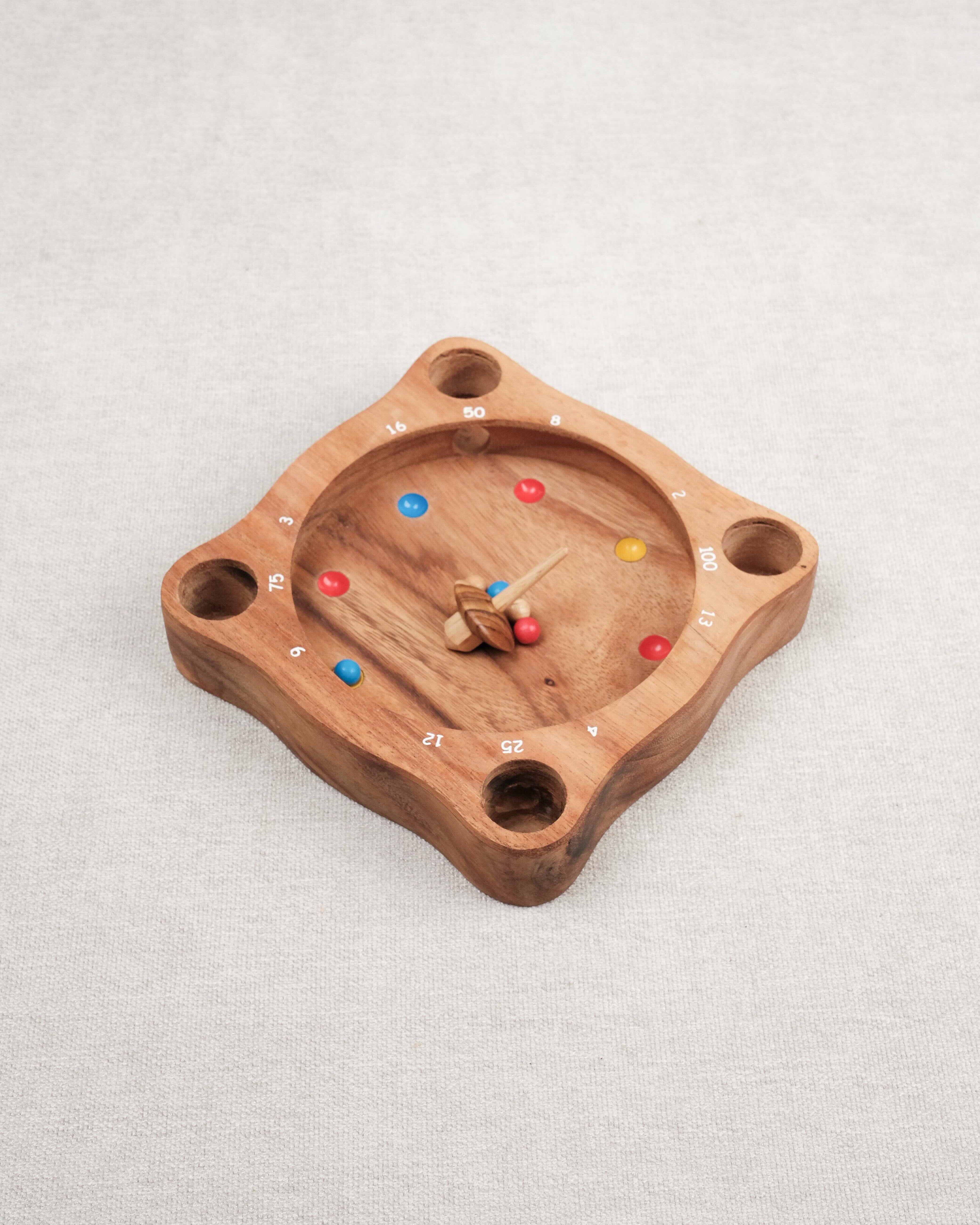 Jeu de La Giroulette en bois avec toupie et billes colorées