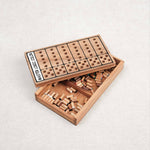 Boîte ouverte de Master Color avec ses pions de couleurs