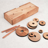 Disques et piquets du casse-tête en bois La Tour de Hanoï démontés – Jeux Faugère