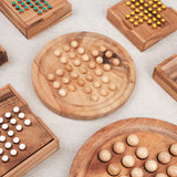 Solitaire rond format M en bois Jeux Faugère, comparé à d'autres modèles de solitaire