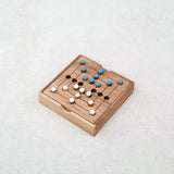 Jeu de Marelle (ou Moulin) en bois Jeux Faugère – plateau ouvert avec pions clairs et foncés