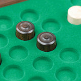 Rangement feutré vert avec pions de dames en bois