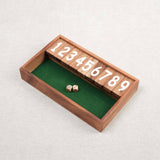 Petit modèle du jeu Ferme la Boîte en bois avec dés.
