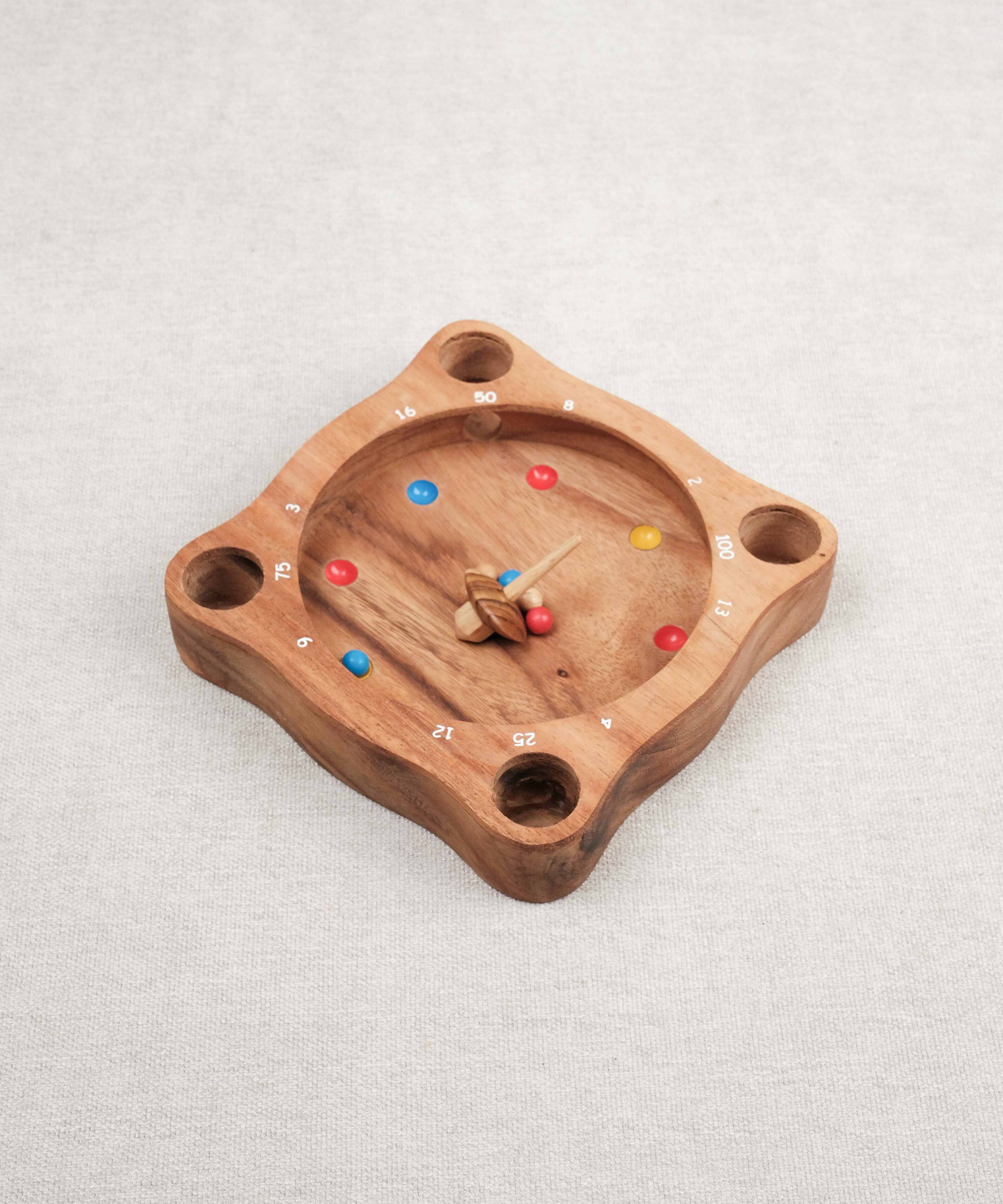 Jeu de La Giroulette en bois avec toupie et billes colorées